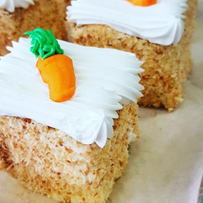 Made from freshly ground carrots, this carrot cake is rolled in roasted coconuts, and topped with handmade vanilla buttercream.
